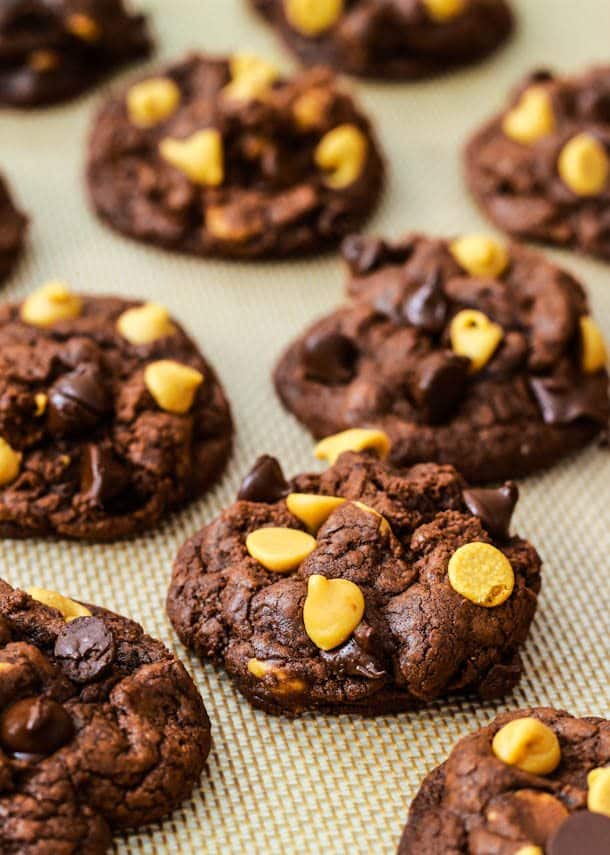 chocolate peanut butter chip cookies on a silpat baking mat