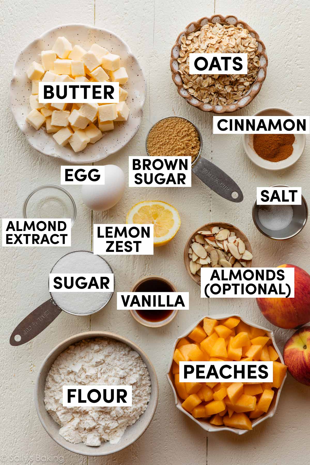 ingredients measured in bowls including oats, butter, flour, vanilla, almonds, cinnamon, and egg.