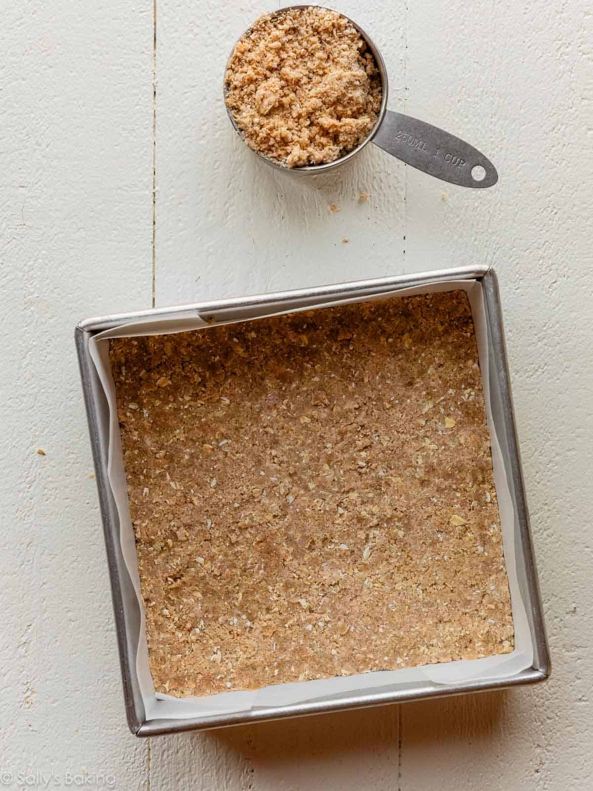 crust pressed into square pan.