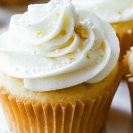 white wedding cupcakes on a white plate