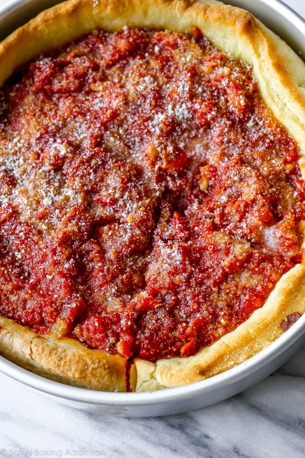 deep dish pizza in a baking pan