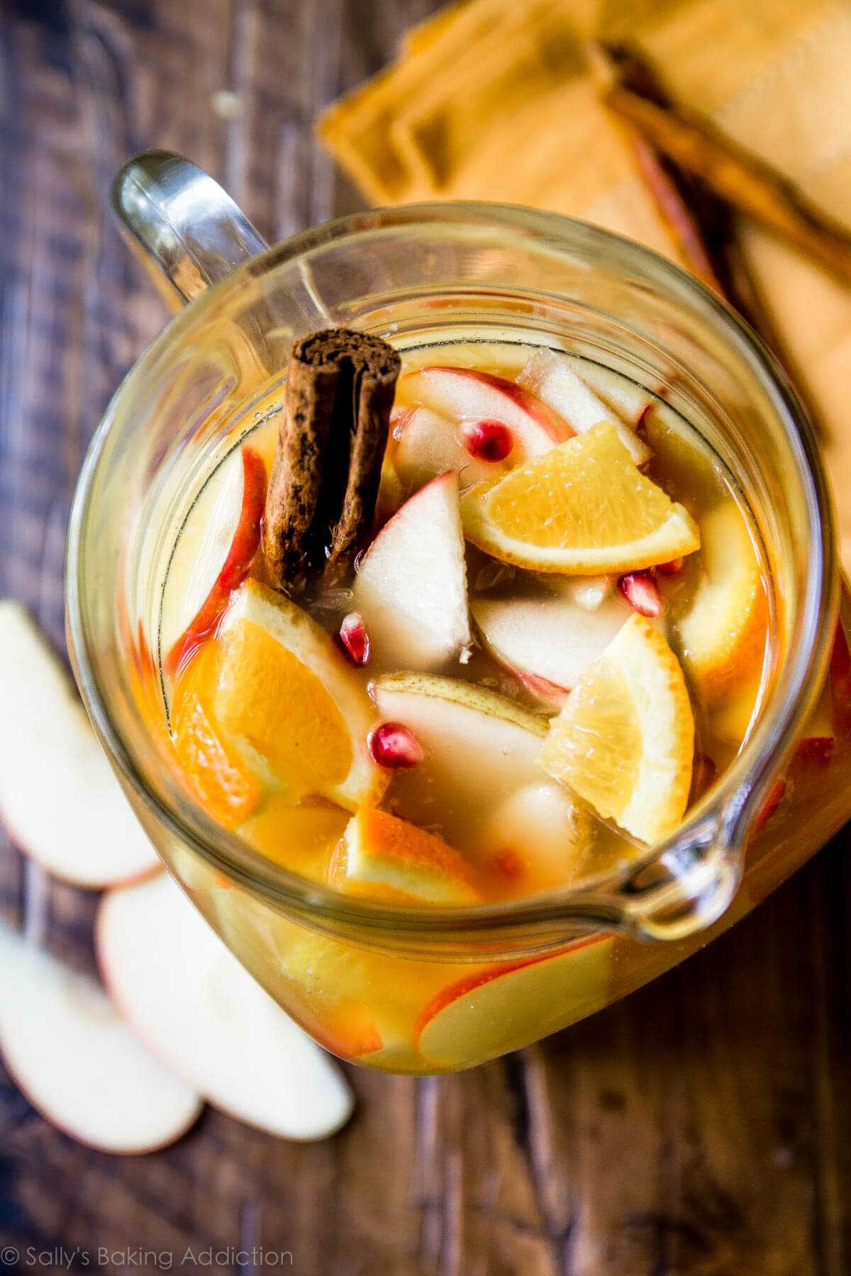 overhead image of a glass pitcher full of apple cider sangria
