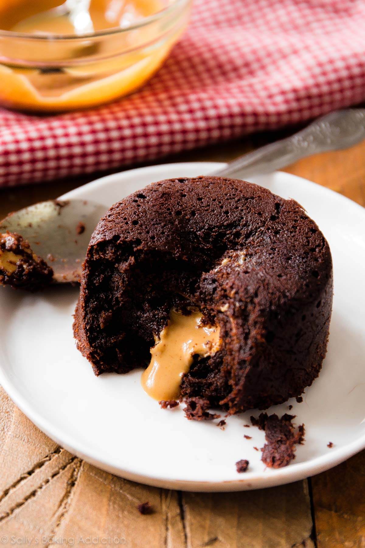 peanut butter chocolate lava cake with peanut butter center on a white plate