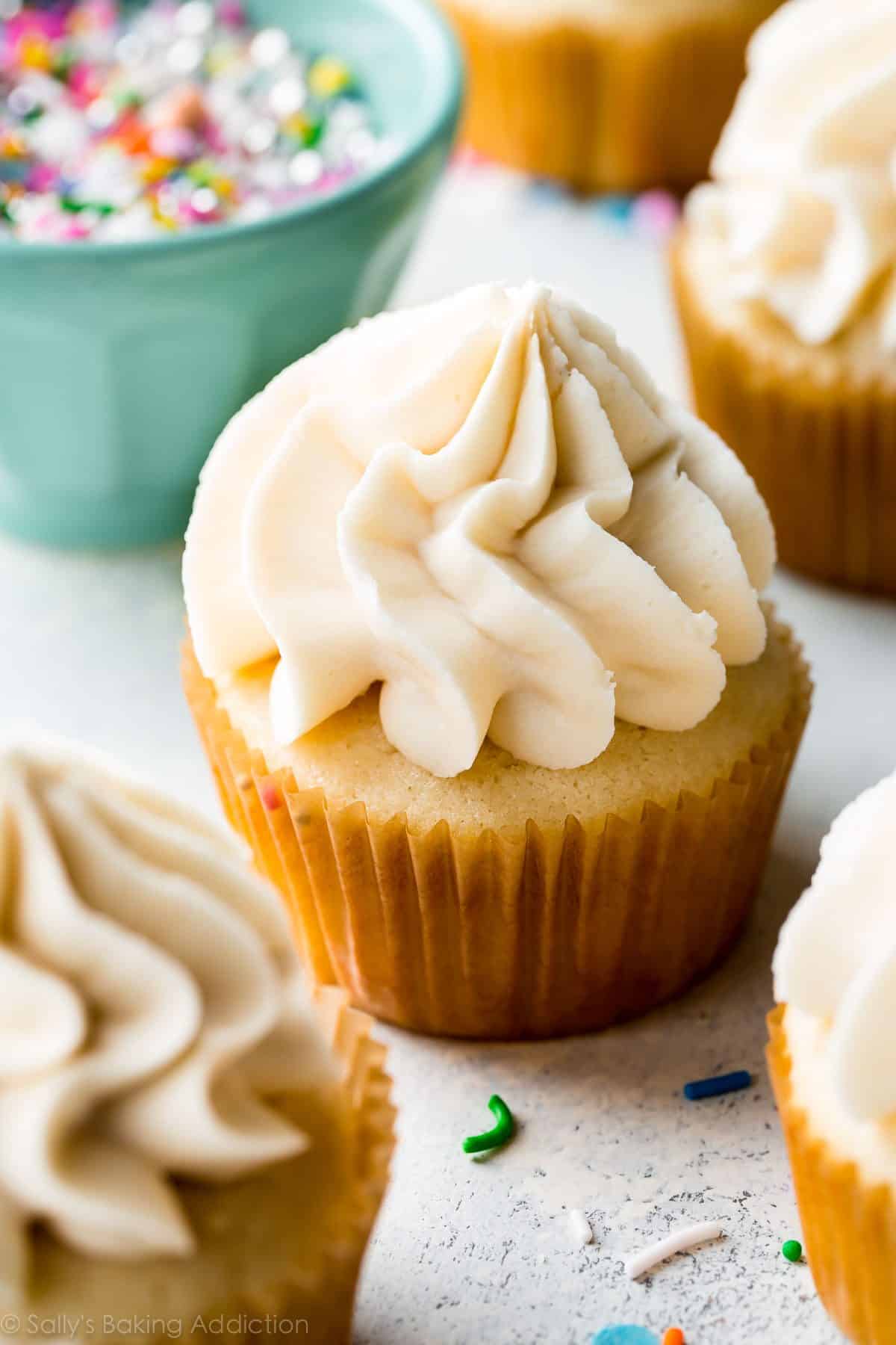 piñata cupcake with vanilla frosting