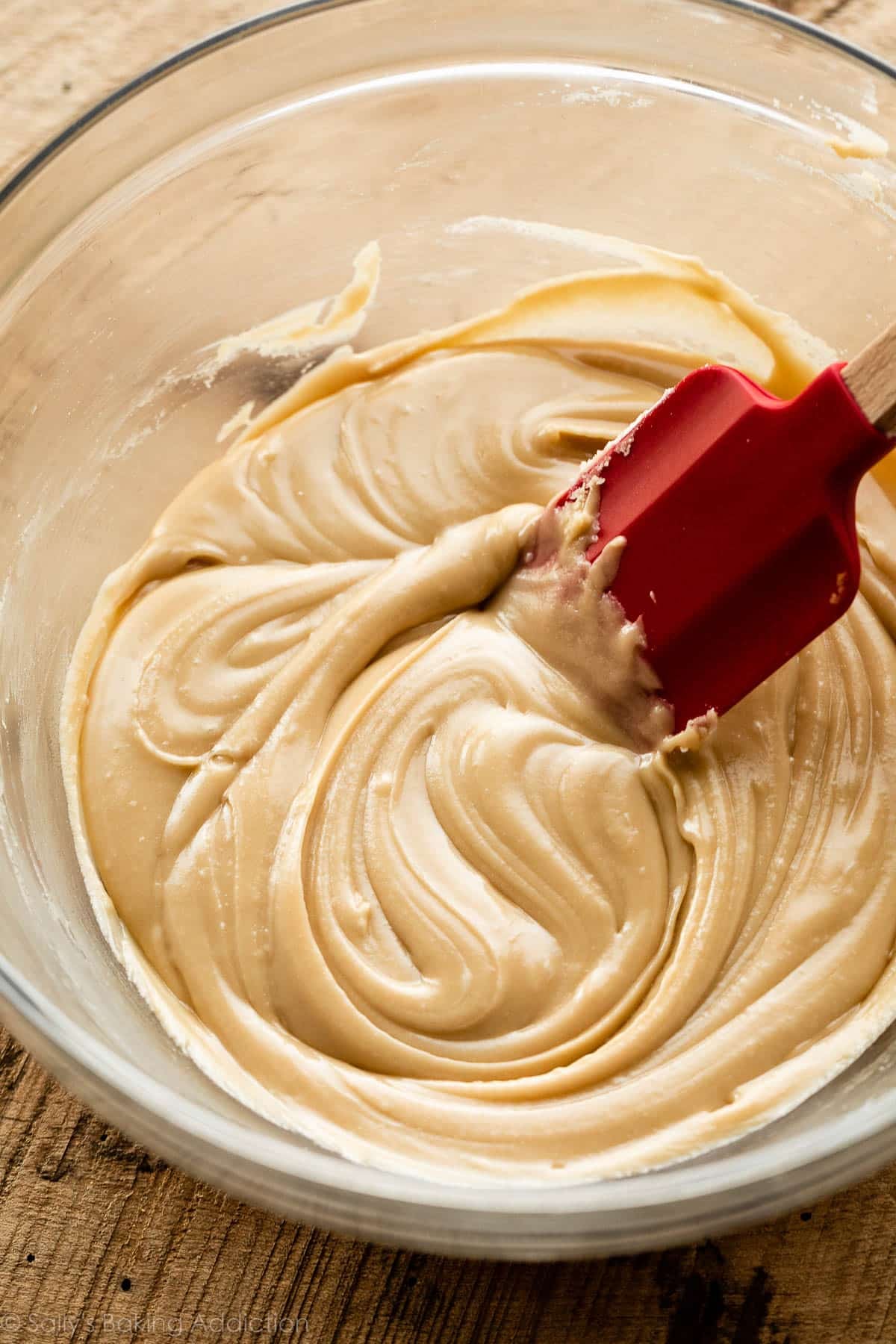 salted caramel frosting thickened in glass bowl.