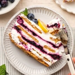 slice of blueberry lemon icebox cake on plate.