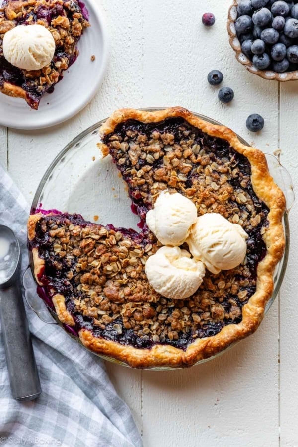 blueberry crumble pie with ice cream on top.