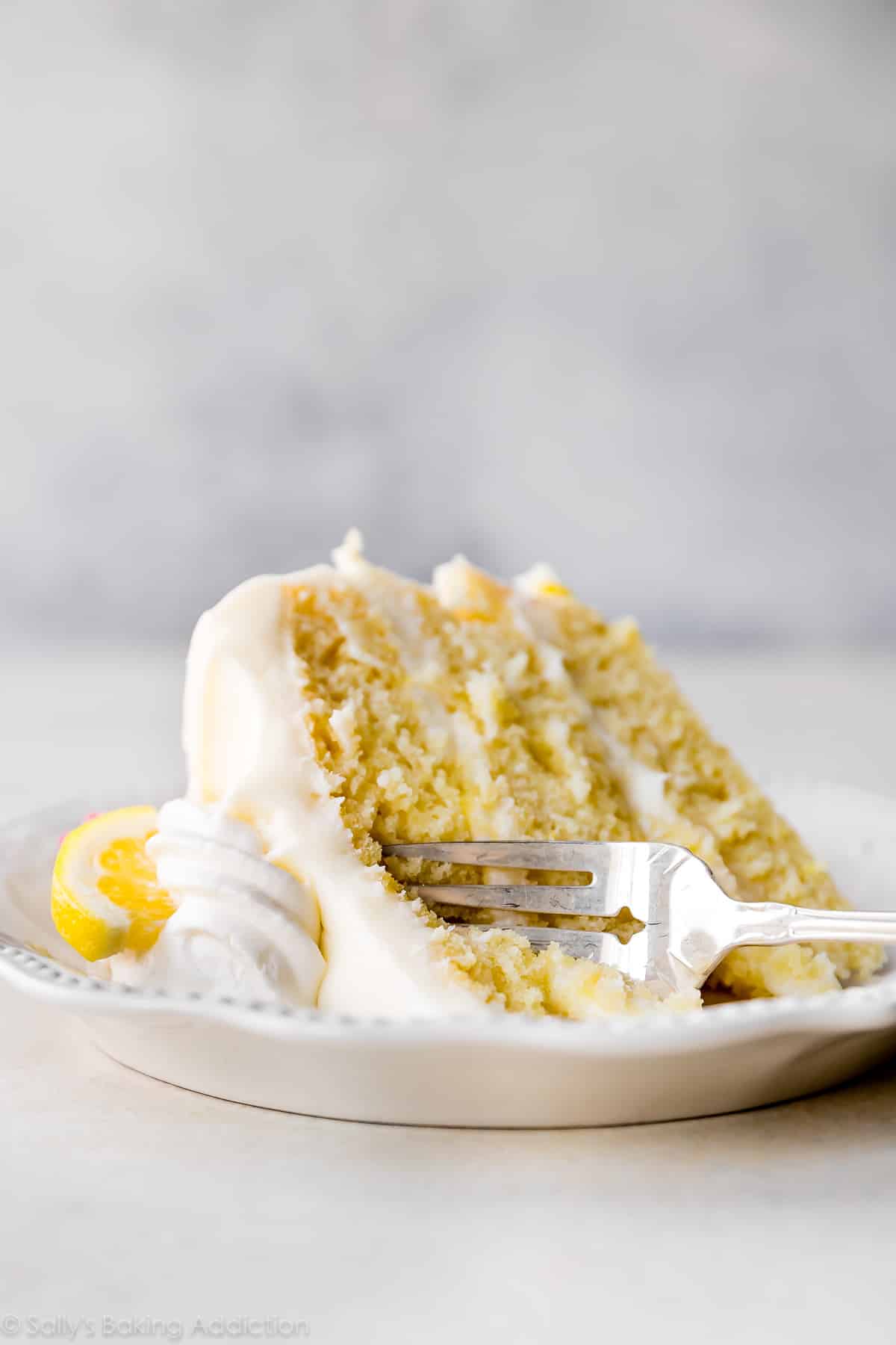 slice of lemon cake on a white plate
