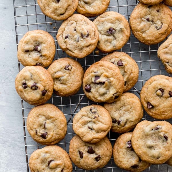 crispy chocolate chip cookies on a cooling rack