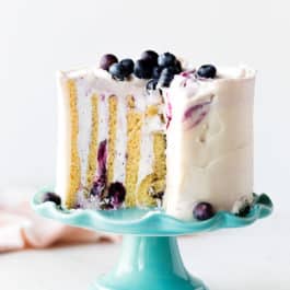 vertical cake on a teal cake stand