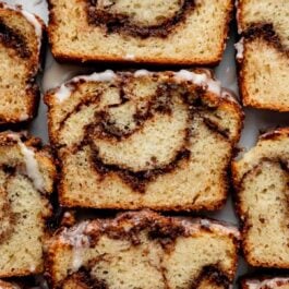slices of cinnamon swirl bread with icing on top.
