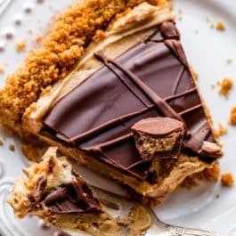 slice of peanut butter cup tart on a white plate