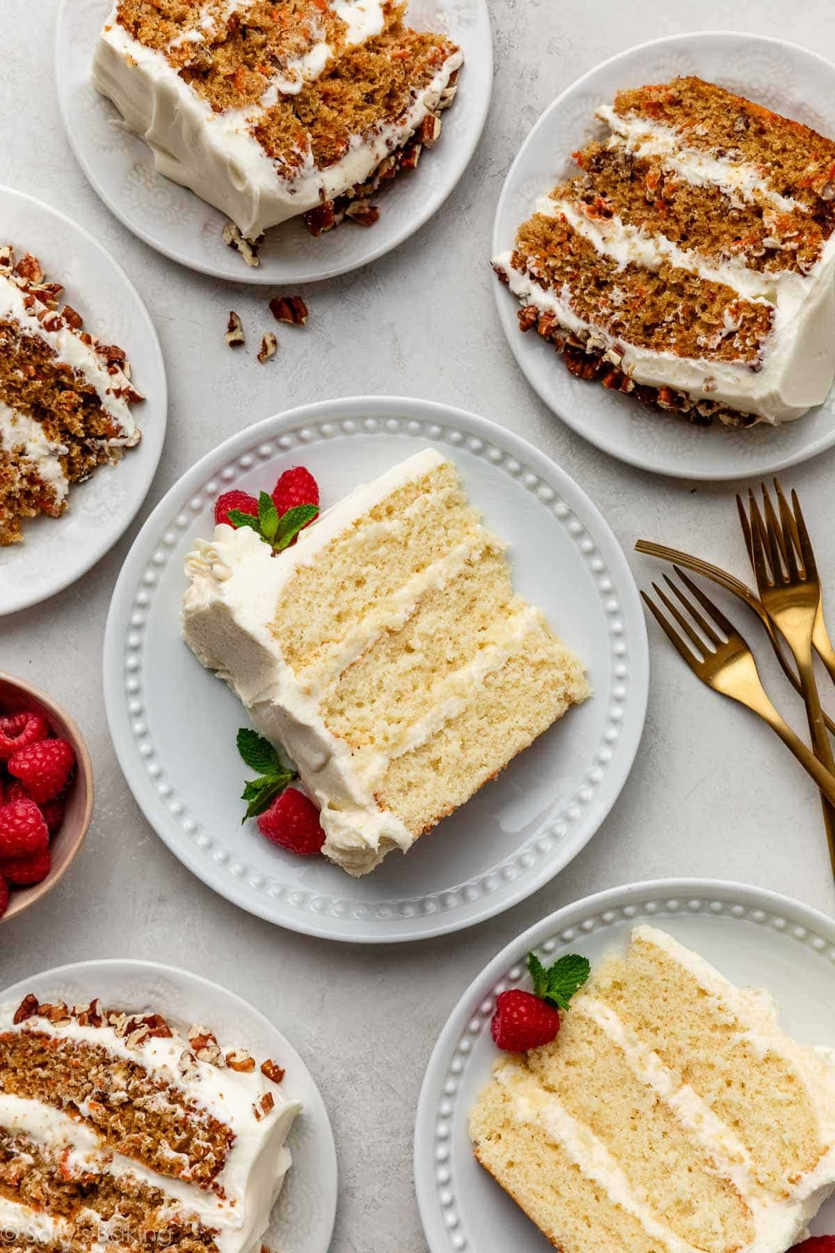 plates of slices of layer cake including vanilla cake and carrot cake.