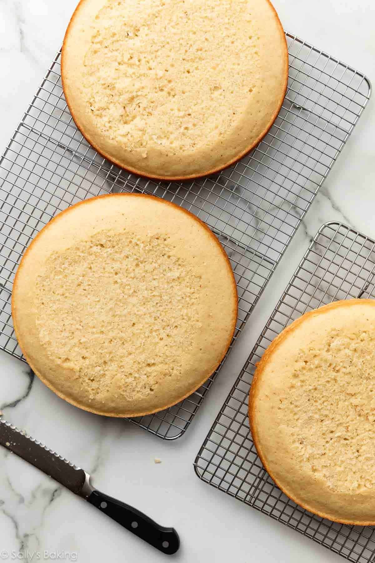 leveled cake layers on cooling rack.